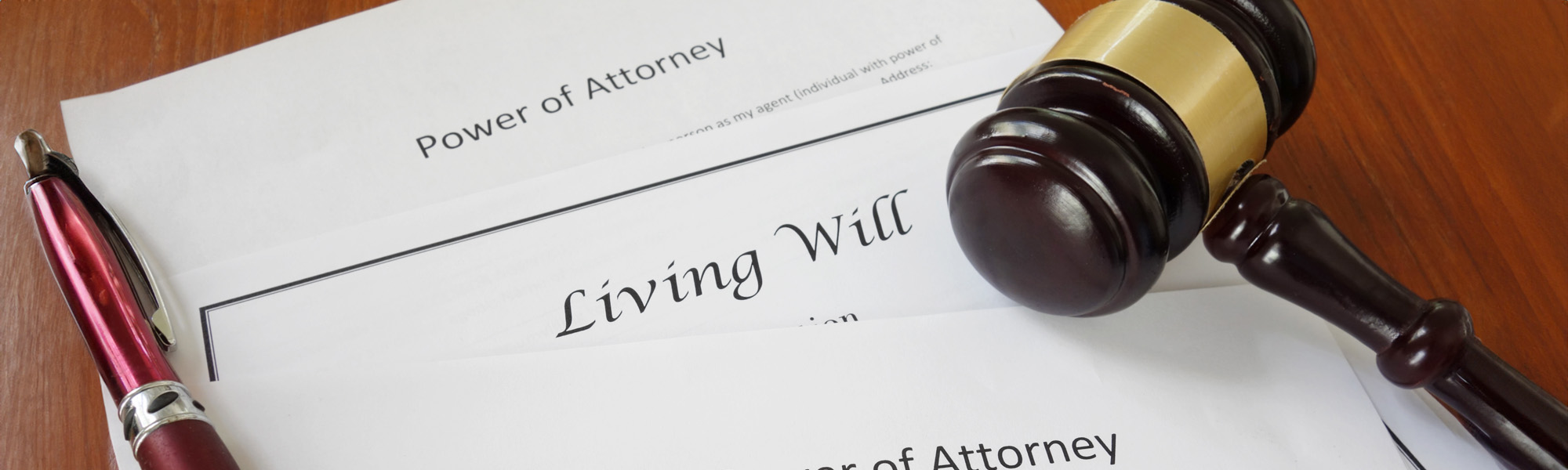 Living will and power of attorney documents with gavel - Tampa Will Lawyers concept image