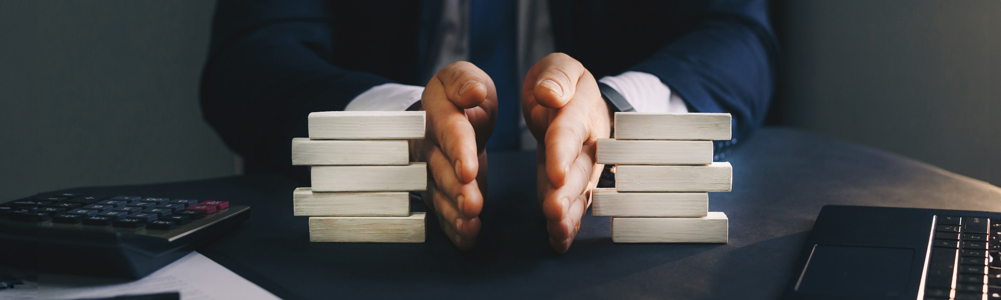 businessman separates wooden block