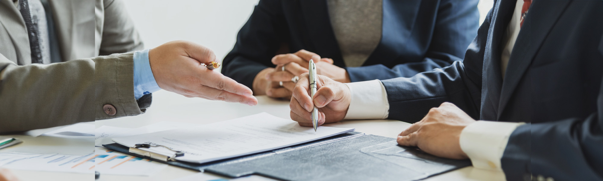 group of business people at the meeting and sign a together business investment agreement