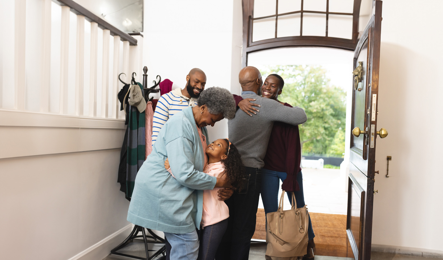 happy african american family entering house and welcoming each other