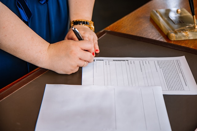 woman signing document