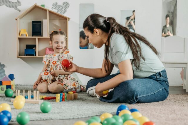 woman playing with child