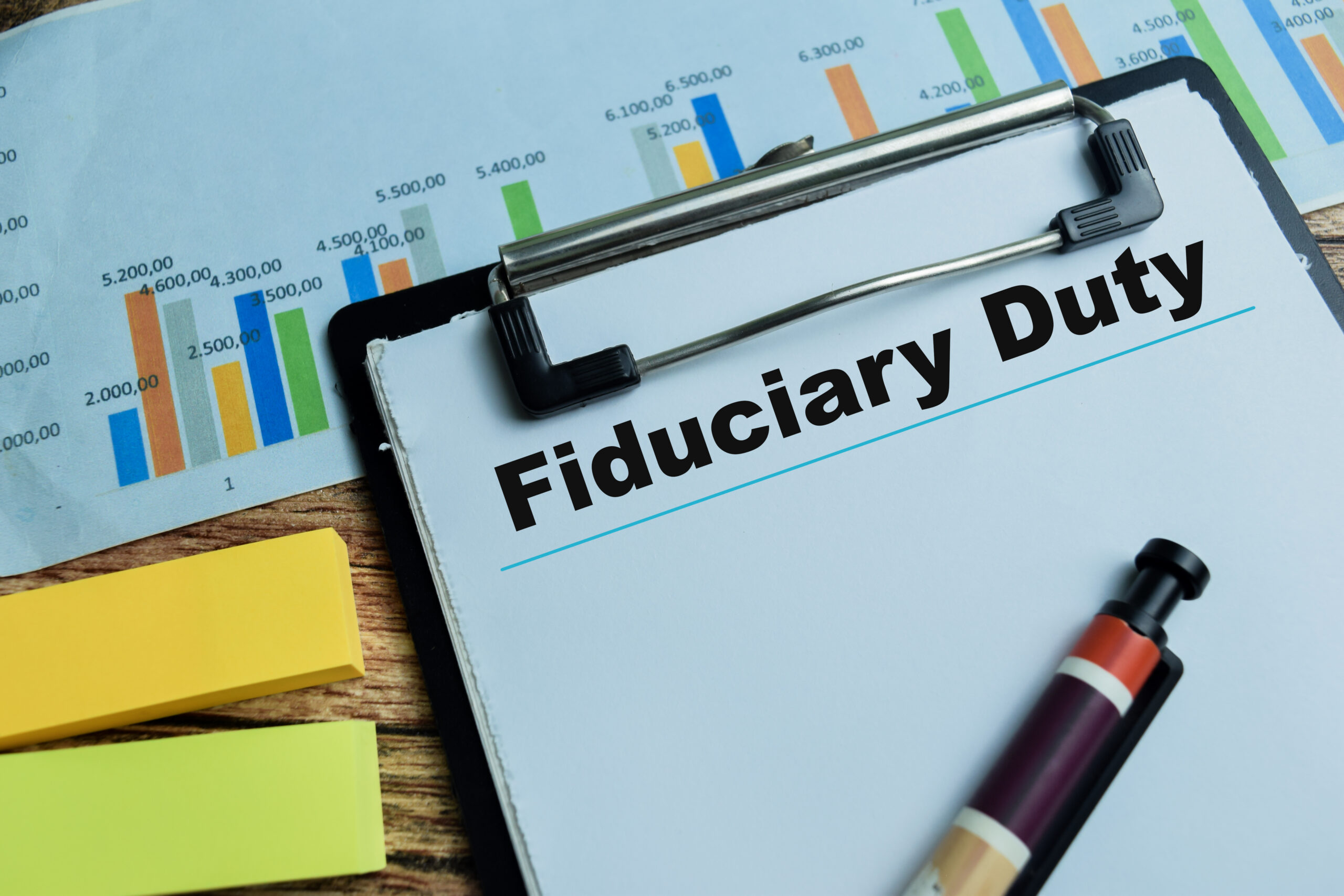 Concept of Fiduciary Duty write on paperwork isolated on wooden background.